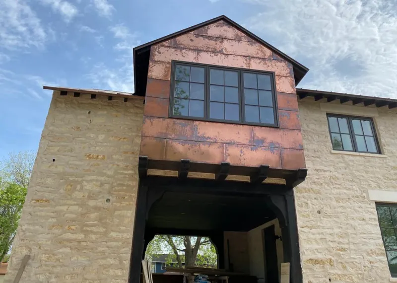 Copper metal panel facade on a stone building for Metal Roof Coating in Temple Terrace